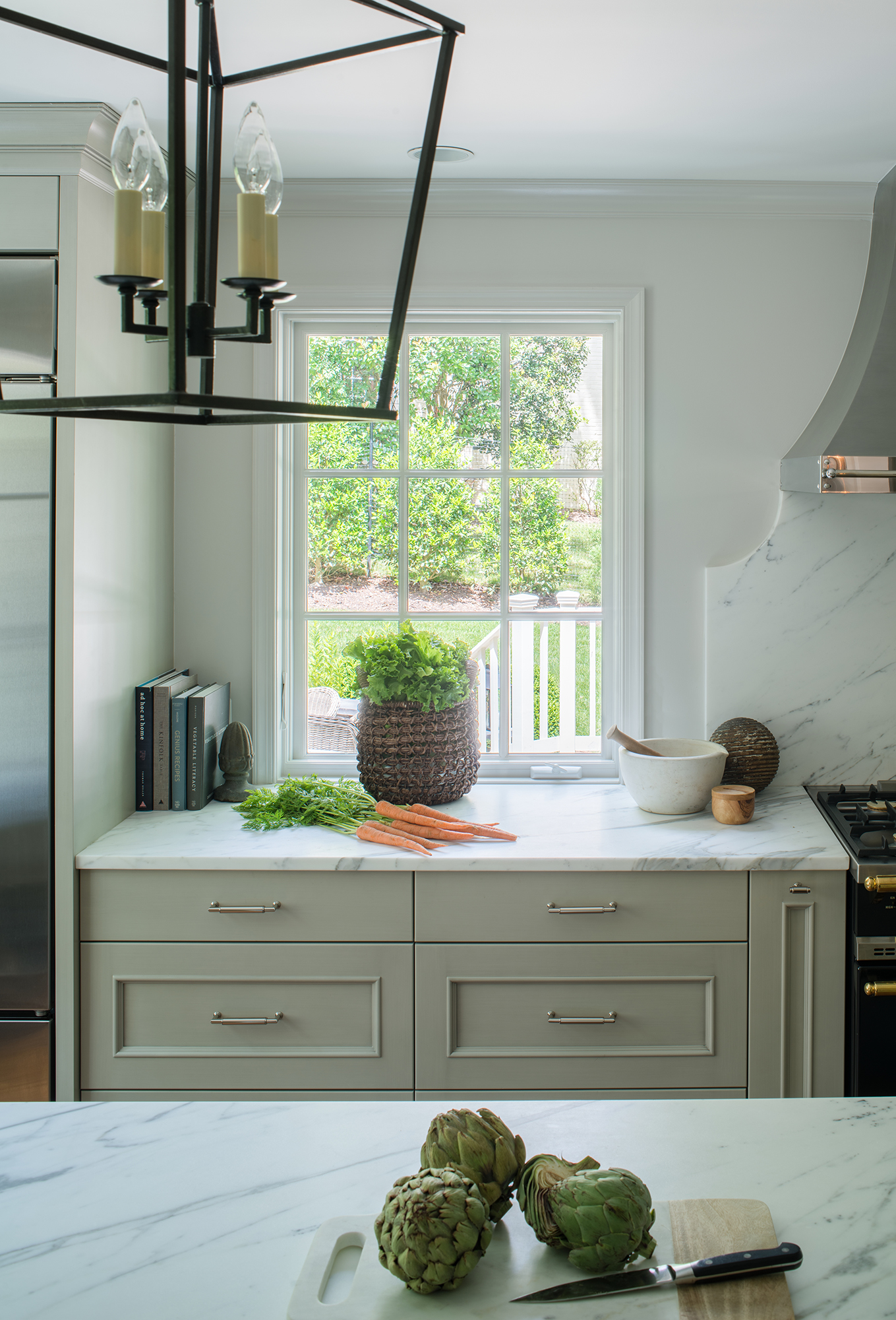 White marbled kitchen with dinner being prepared