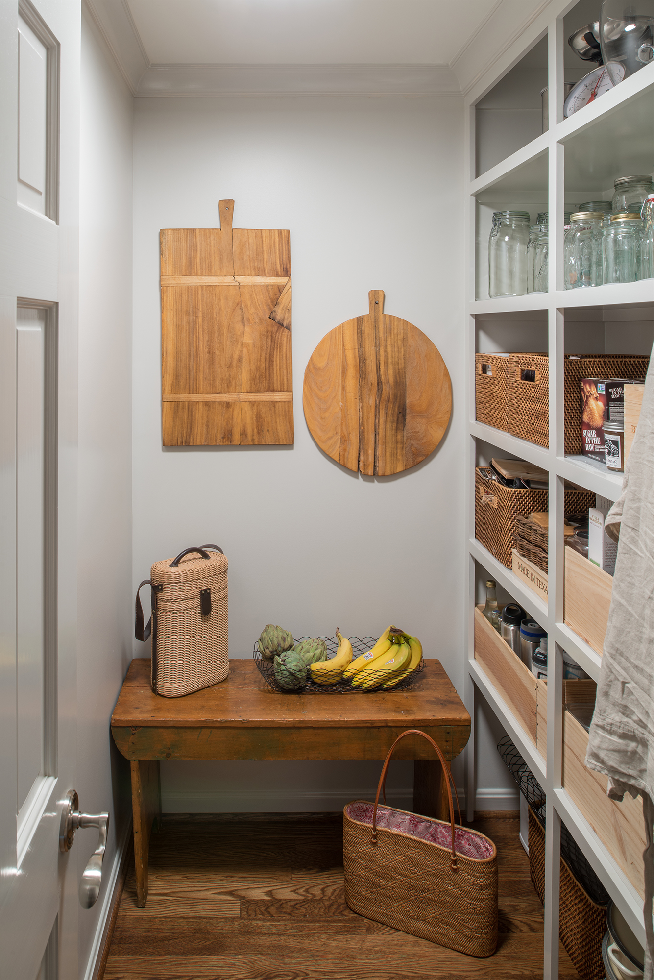 Built in cabinetry in hardwood floor pantry