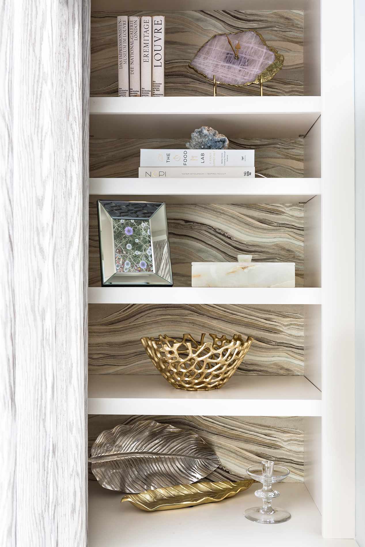 Wallpaper backed built-in shelving