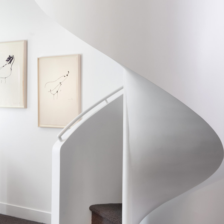 Curved white indoor stiarwell