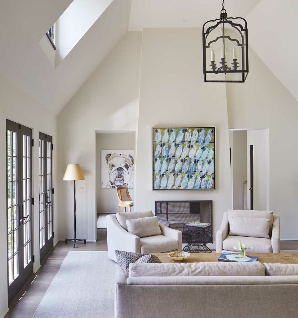 family room with artwork on the walls inside a whole home renovation in Bethesda by Anthony Wilder