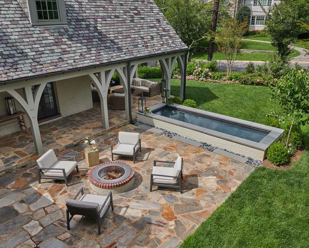 bethesda md home renovation photo showing flagstone patio with firepit and water feature